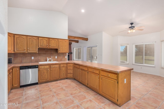 kitchen featuring sink, vaulted ceiling, stainless steel dishwasher, ceiling fan, and kitchen peninsula