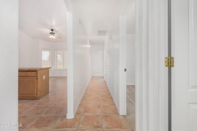 hallway with light tile patterned floors