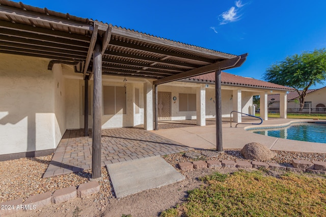 rear view of property featuring a patio area