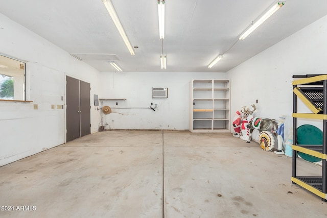 garage featuring a wall mounted air conditioner