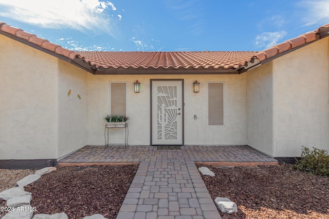 property entrance with a patio