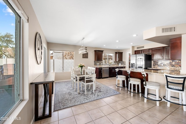 dining room featuring recessed lighting, visible vents, baseboards, and light tile patterned floors