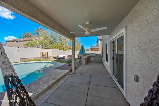 view of patio / terrace with a ceiling fan, a fenced in pool, area for grilling, a fenced backyard, and grilling area