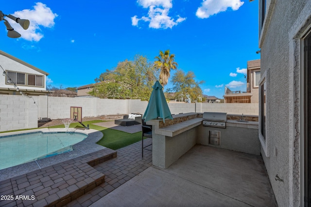 view of patio featuring a fenced backyard, grilling area, a fenced in pool, and area for grilling