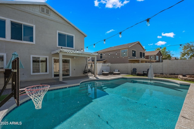 view of pool featuring a patio area, a fenced backyard, and a fenced in pool