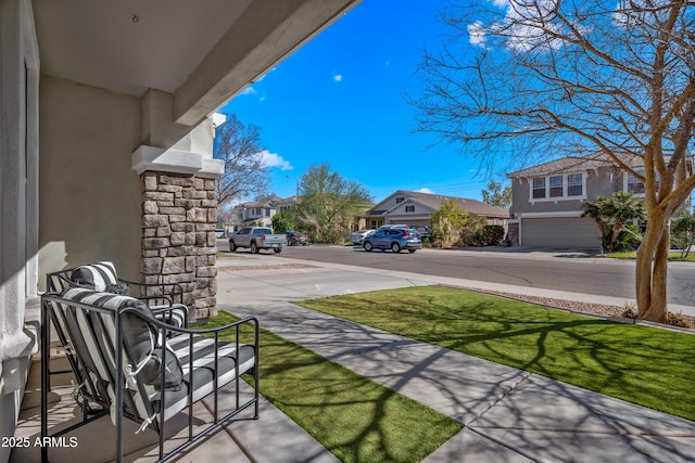 view of yard featuring a residential view