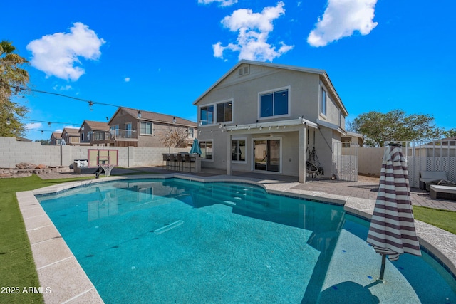 view of swimming pool with a patio, a fenced backyard, and a fenced in pool