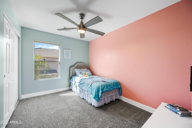 bedroom with a closet, carpet, a ceiling fan, and baseboards