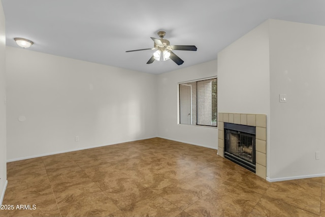 unfurnished living room featuring a fireplace and ceiling fan