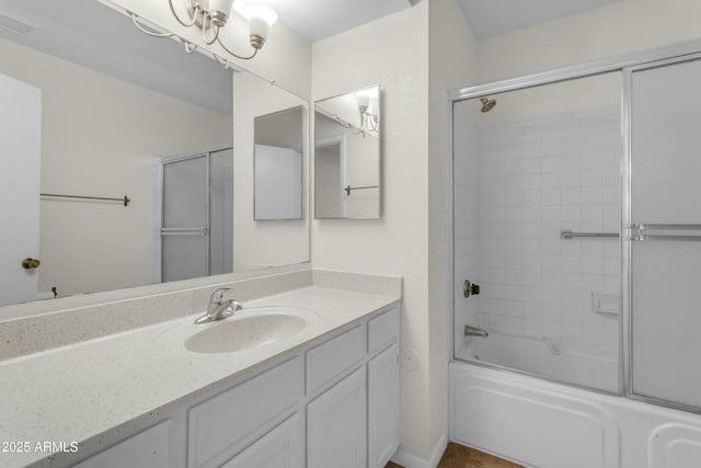 bathroom with vanity and enclosed tub / shower combo