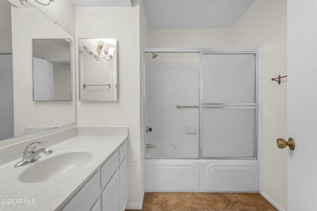 bathroom with enclosed tub / shower combo and vanity