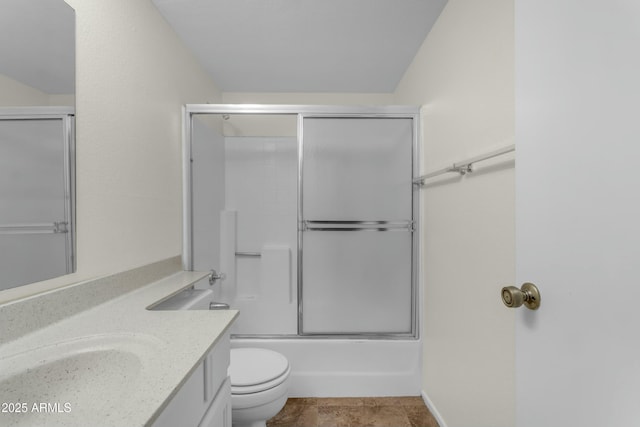 full bathroom with bath / shower combo with glass door, vanity, and toilet