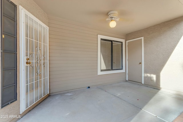 view of patio / terrace featuring ceiling fan