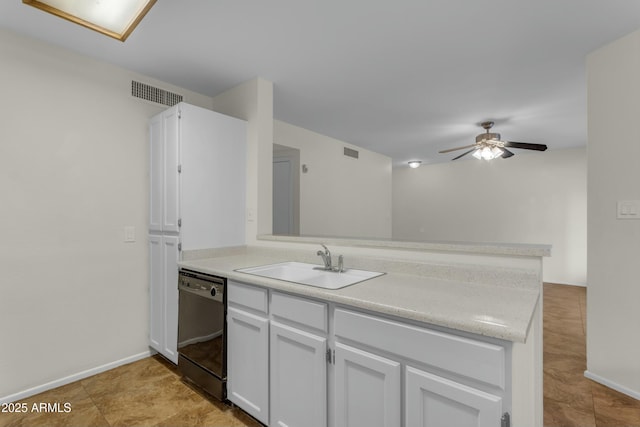 kitchen with sink, ceiling fan, white cabinetry, black dishwasher, and kitchen peninsula