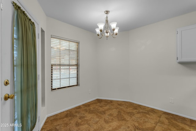 empty room with a chandelier