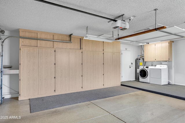garage featuring a garage door opener, water heater, and separate washer and dryer