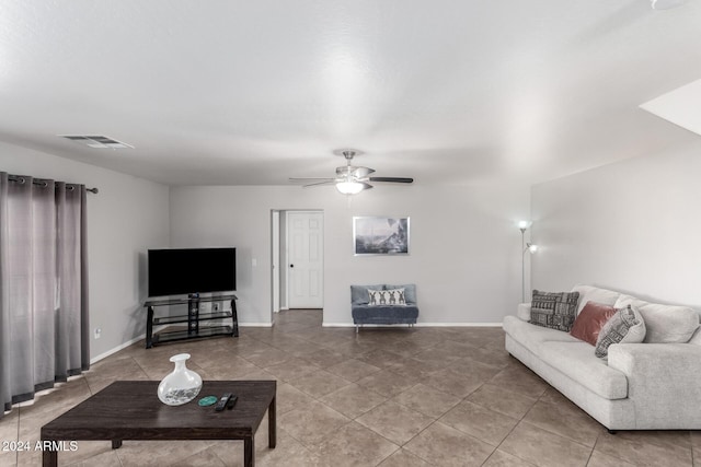 living room with tile patterned flooring and ceiling fan