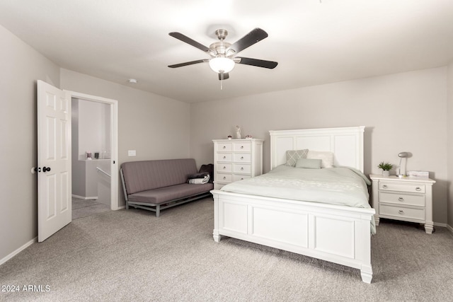 bedroom with ceiling fan and light carpet