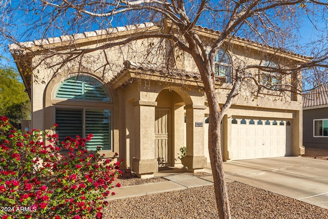 view of front of property with a garage