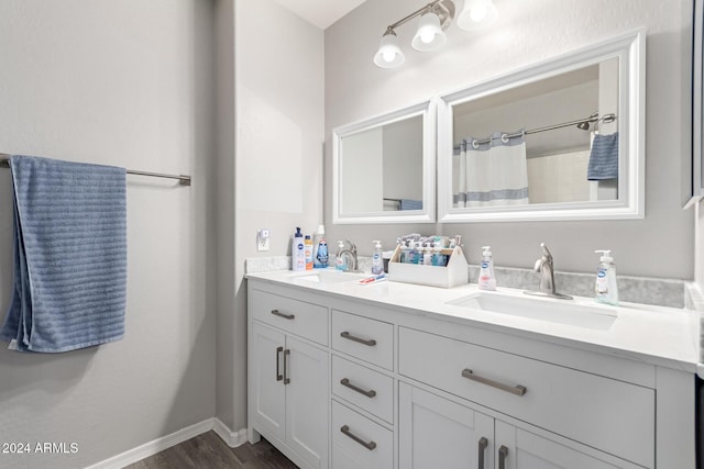 bathroom featuring hardwood / wood-style floors and vanity