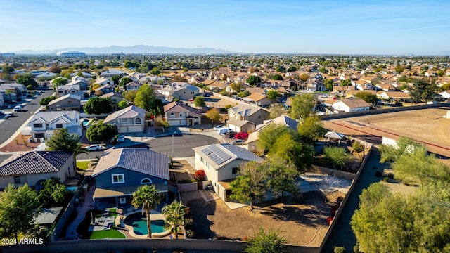 birds eye view of property with a mountain view