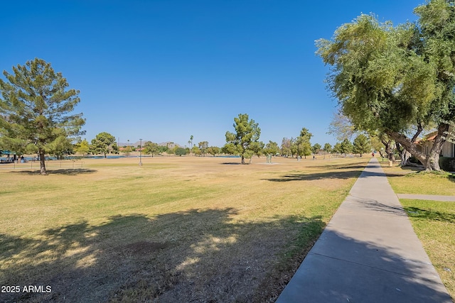 surrounding community featuring a yard