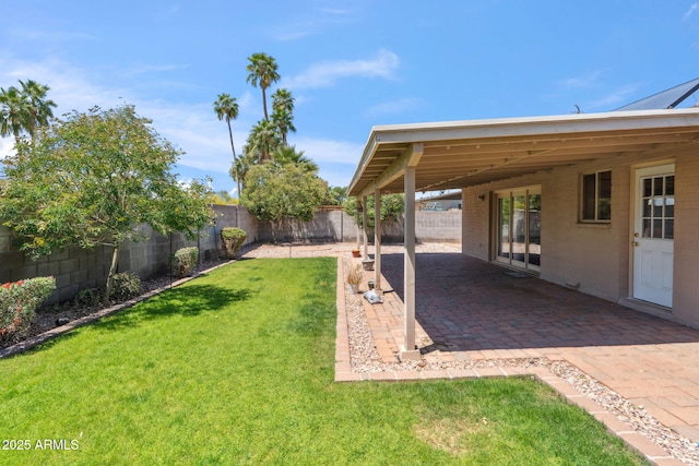 view of yard with a patio and a fenced backyard