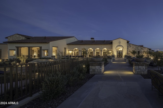 mediterranean / spanish-style home featuring a patio area