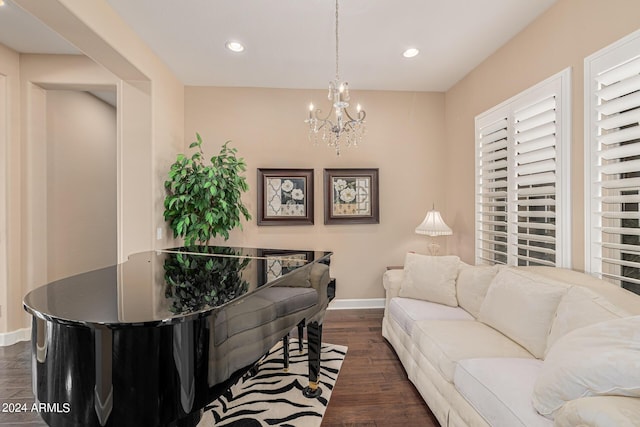 living room featuring dark hardwood / wood-style floors and a notable chandelier