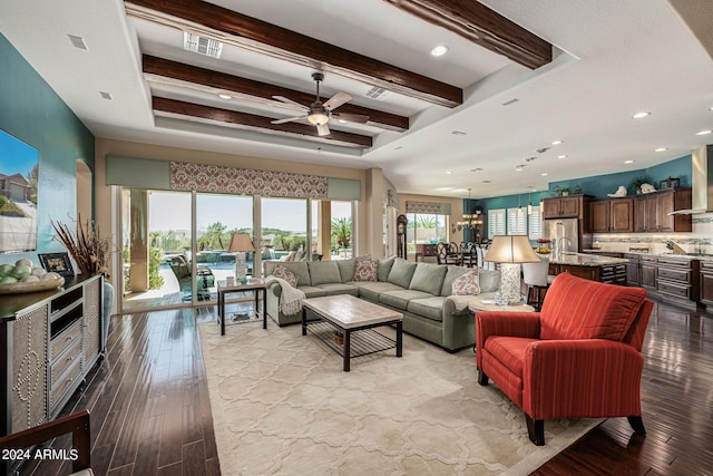 living room featuring beamed ceiling, ceiling fan, and light hardwood / wood-style flooring