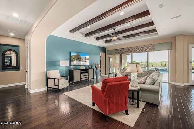 living room featuring beamed ceiling, ceiling fan, and dark hardwood / wood-style flooring