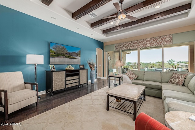 living room featuring beam ceiling, dark hardwood / wood-style floors, and ceiling fan