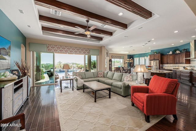 living room featuring ceiling fan, beam ceiling, and light hardwood / wood-style flooring