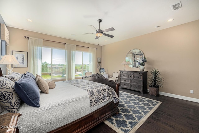 bedroom with dark hardwood / wood-style floors and ceiling fan