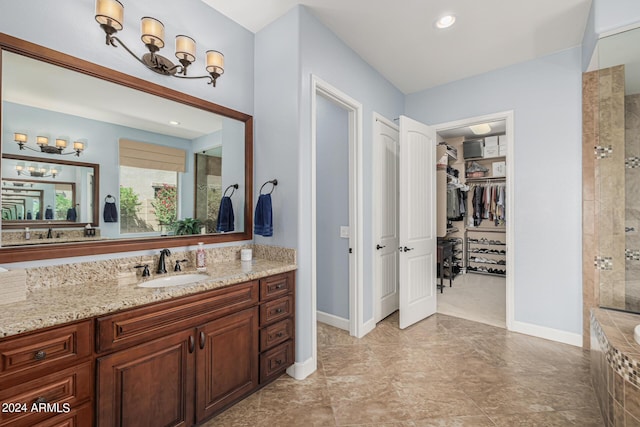 bathroom featuring vanity and shower with separate bathtub