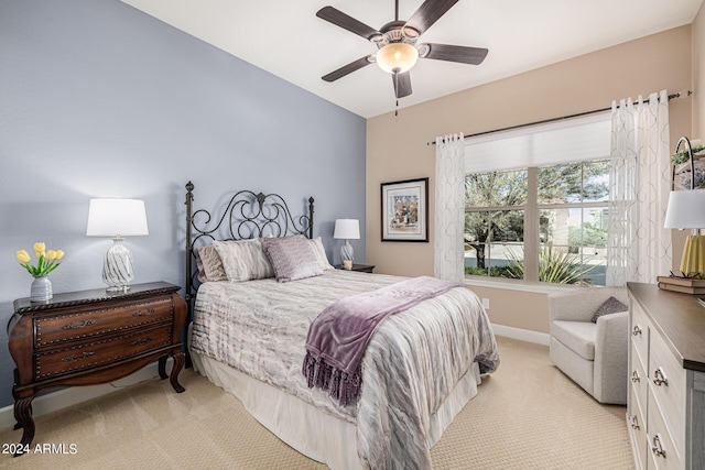 bedroom featuring light carpet and ceiling fan