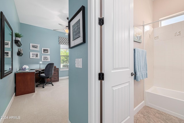 carpeted office space featuring a wealth of natural light and ceiling fan