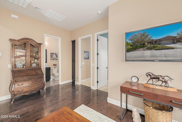 corridor with dark hardwood / wood-style floors