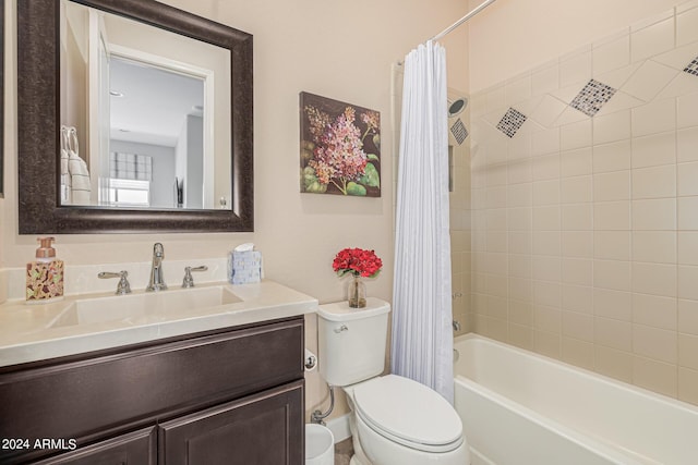 full bathroom with shower / bathtub combination with curtain, vanity, and toilet