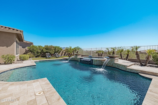 view of pool featuring pool water feature, an in ground hot tub, and a patio area