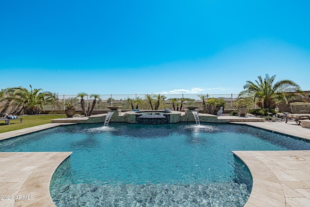 view of swimming pool featuring pool water feature, an in ground hot tub, and a patio