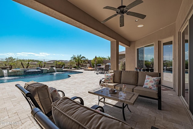 view of patio featuring pool water feature, ceiling fan, a swimming pool with hot tub, and an outdoor hangout area