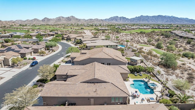 birds eye view of property with a mountain view