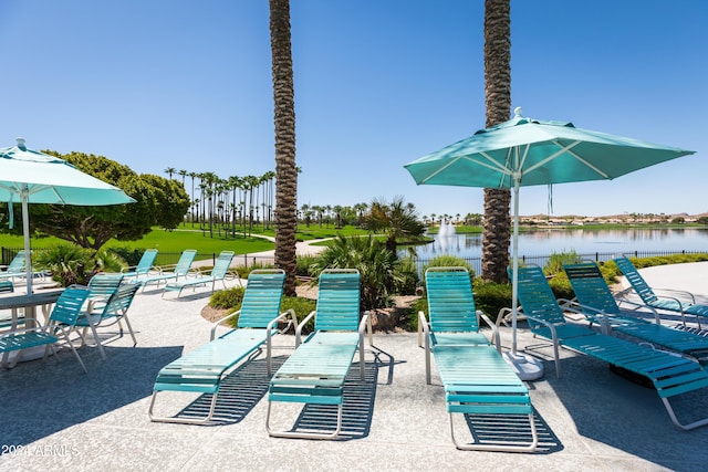 view of patio with a water view