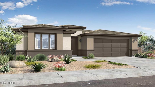 prairie-style house with concrete driveway, an attached garage, and stucco siding