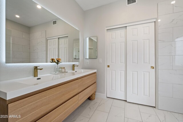 19203 N 39th Way, Phoenix, AZ 85050 - bathroom with visible vents, marble finish floor, and a sink