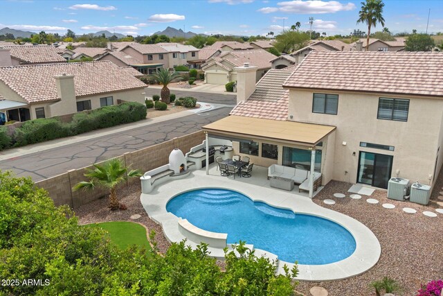 19203 N 39th Way, Phoenix, AZ 85050 - view of swimming pool with a residential view, central AC unit, a fenced backyard, and an outdoor hangout area