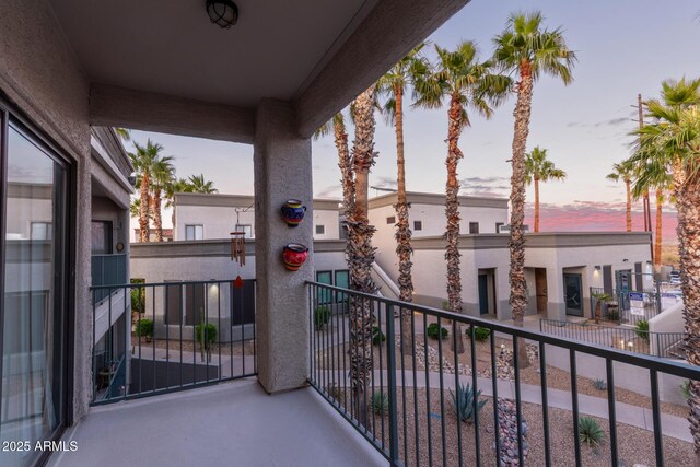 view of balcony at dusk