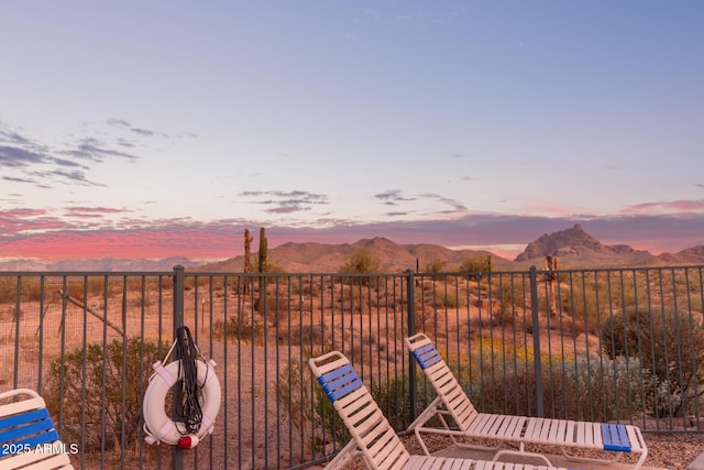 view of yard with a mountain view and fence