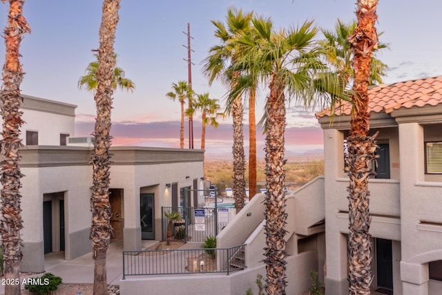 view of property at dusk